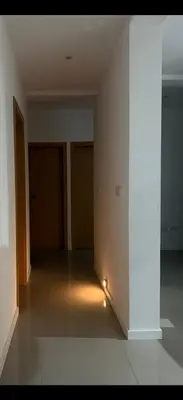an empty room with a hallway with doors and lights at Ponta do Sol 