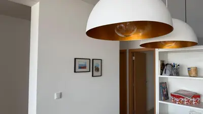 a large light fixture hanging over a room at Ponta do Sol 