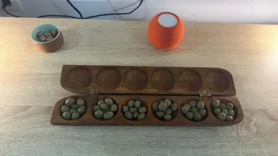 a wooden tray filled with balls on top of a table at Ponta do Sol 
