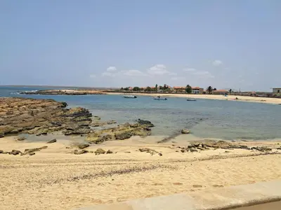 a beach with some boats in the water at Vivenda Mia in Beirona