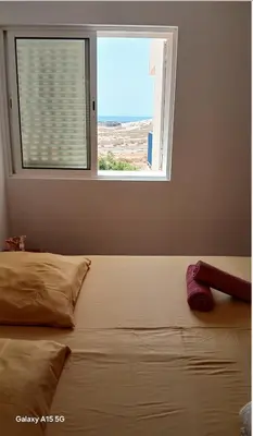 a bed in a bedroom with a window at Pandora Ocena View II in Sal Rei