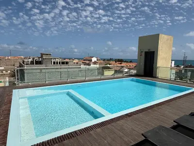 a swimming pool on the roof of a building at Santa Maria Residence - Central T2 in Santa Maria