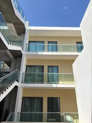 an apartment building with balconies and a blue sky at Santa Maria Residence - Central T2 in Santa Maria