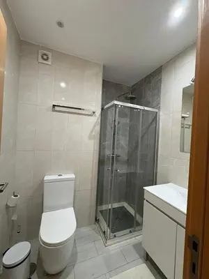 a bathroom with a shower and a toilet and a sink at Santa Maria Residence - Central T2 in Santa Maria