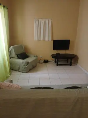 a living room with a couch and a chair at Mar&Cruz in Mindelo