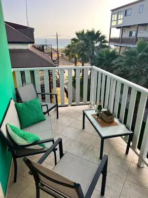 a balcony with two chairs and a table with a view at Estrella Do Mar Santa Maria in Santa Maria