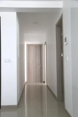 an empty room with a door and a hallway at Alto in Mindelo