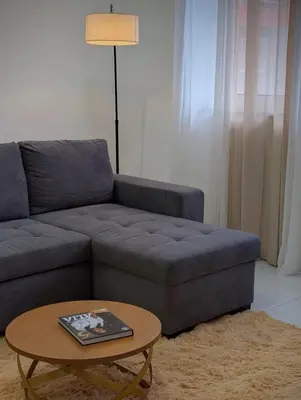 a living room with a couch and a coffee table at Modern and Stylish 1BR Apt - Cidadela - Ground Floor in Praia