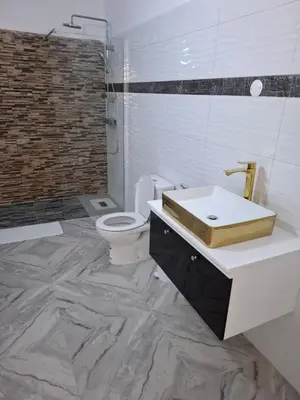 a bathroom with a sink and a toilet and a shower at Apartamentos Fatynybal in Espargos