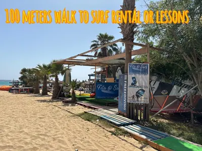 a beach with a few surfboards on the sand at Casa Paradise in Santa Maria