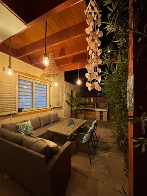 a living room with a couch and a table at Casa Paradise in Santa Maria