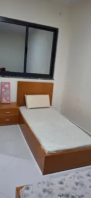 a small bedroom with a bed and a window at Aconchego da Bety in Praia