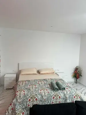 a bedroom with a bed with two pillows on it at Repousando no terraço in Ribeira Grande