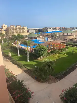 a view of a resort with a swimming pool at Tropical Oceano in Santa Maria