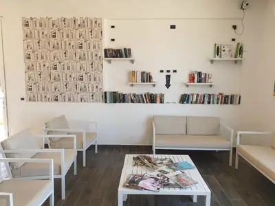 a waiting room with couches and a table at Aparthotel Por do Sol in Sal Rei