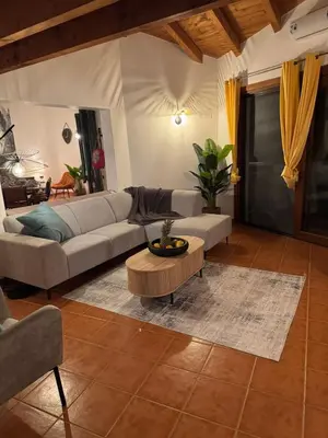 a living room with a couch and a coffee table at Casa Anzso Ocean view Porto Antigo I in Santa Maria