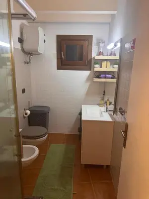 a small bathroom with a toilet and a sink at Casa Anzso Ocean view Porto Antigo I in Santa Maria