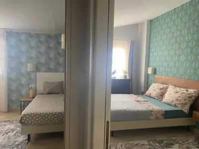 a bedroom with a bed and a window at Tropical Anzso in Santa Maria