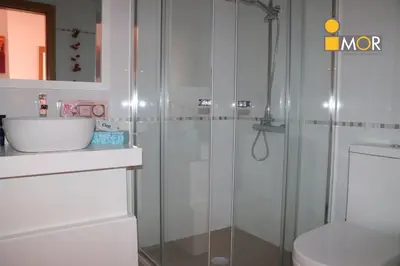 a bathroom with a shower with a toilet and a sink at 3-bedroom Apartment Praia Santiago in Praia