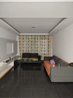 a living room with a couch and a table at Sofia Évora Spínola in Cova Figueira