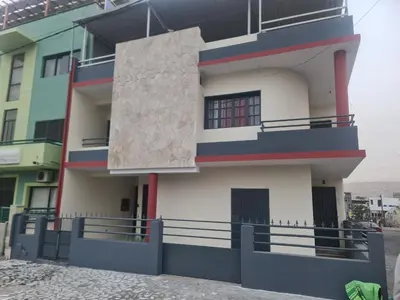 a view of the front of a building at Cozy Apartment, 3 Bedrooms in Praia