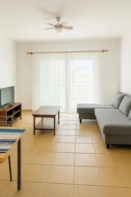 a living room with a couch and a table at Casa di Mar in Santa Maria