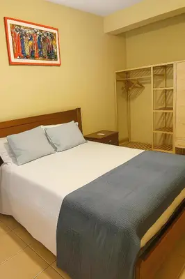 a bedroom with a large white bed and a mirror at Casa di Mar in Santa Maria