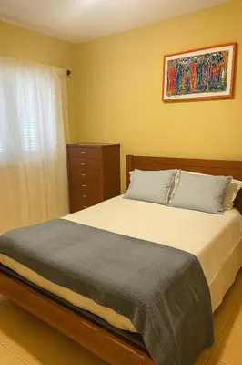 a bedroom with a large bed and a window at Casa di Mar in Santa Maria