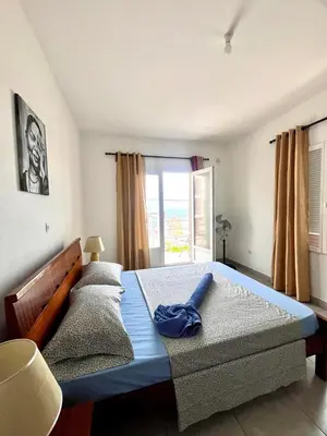 a bedroom with two beds and a window at Casa BB&Djassi - Apartment T3 in Ponta do Sol