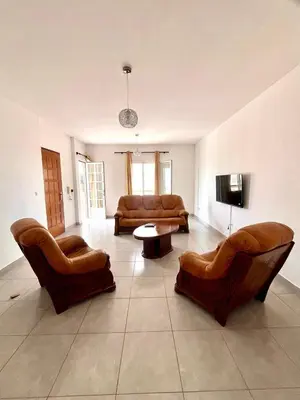 a living room with leather furniture and a flat screen tv at Casa BB&Djassi - Apartment T3 in Ponta do Sol