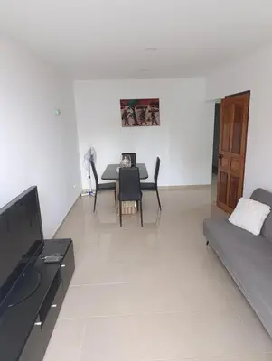 a living room with a table and a couch at Sossego & Conforto in Espargos