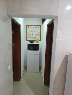 a kitchen with a stove and a dishwasher in a room at Sossego & Conforto in Espargos