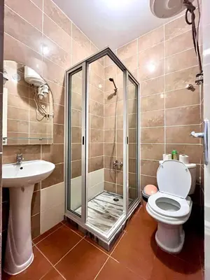 a bathroom with a shower and a toilet and a sink at Casa BB&Djassi - Apartment T1 in Ponta do Sol