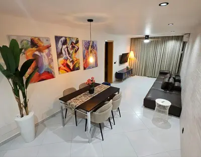 a living room with a table and a couch at Apartamentos Esperança in Sal Rei