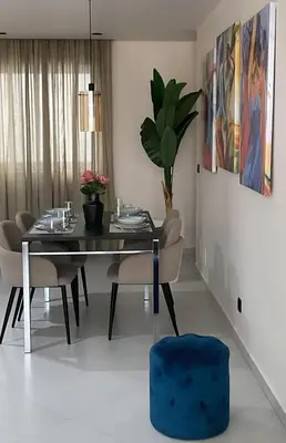 a dining room with a black table and chairs at Apartamentos Esperança in Sal Rei
