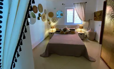 a bedroom with a large bed in a room at Joia Escondida in Santa Maria