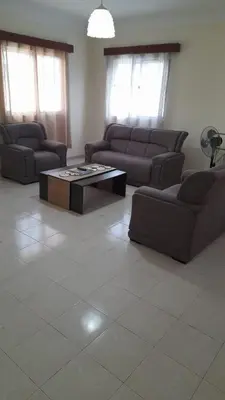 a living room with couches and a coffee table at Apart SilvaGomes in Praia