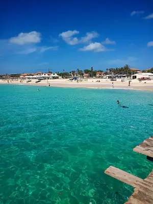 a view of a beach with people in the water at Cosy 2 Bed Apartment Vila Verde Santa Maria in Santa Maria