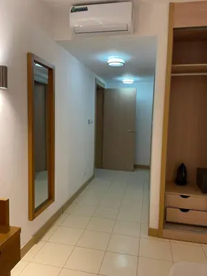 an empty hallway with a mirror and a door at Cosy 2 Bed Apartment Vila Verde Santa Maria in Santa Maria