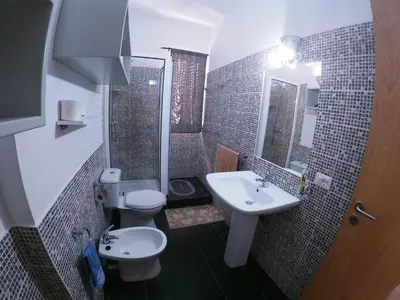 a small bathroom with a toilet and a sink at Endless Summer B6 in Sal Rei