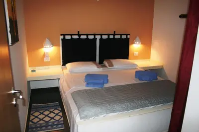 a bedroom with a bed with two blue towels on it at Endless Summer B6 in Sal Rei