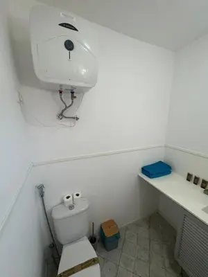 a small bathroom with a toilet and a sink at Murdeira V152 Duplex by RPG Group in Beirona