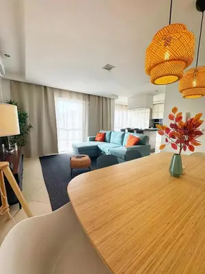 a living room with a table and a couch at Mindelo Bay Apartment in Mindelo