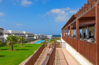 a view of the beach from the balcony of a resort at Meliá Laguna Beach in Santa Maria