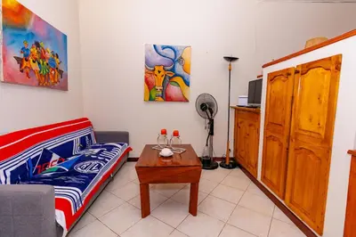 a living room with a couch and a table at T1 - 800m from the beach - located in the city center in Santa Maria