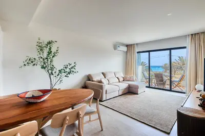 a living room with a table and a couch at Sal & Mar in Santa Maria