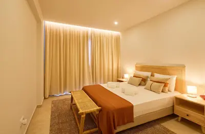 a bedroom with a large bed and a window at Sal & Mar in Santa Maria