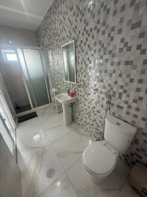 a bathroom with a toilet and a sink at MeloMar Rooms in Ponta do Sol