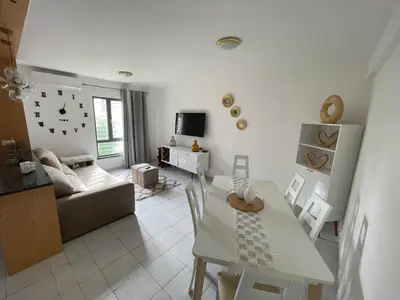 a living room with a table and a couch at Dormir à Praia Cap vert autour de l'aéroport in Praia
