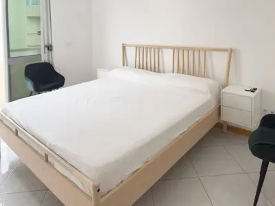 a bed in a hospital room with two chairs at 3 bdr cozy apt, Exterior POOL , Cidadela - LCGR in Praia